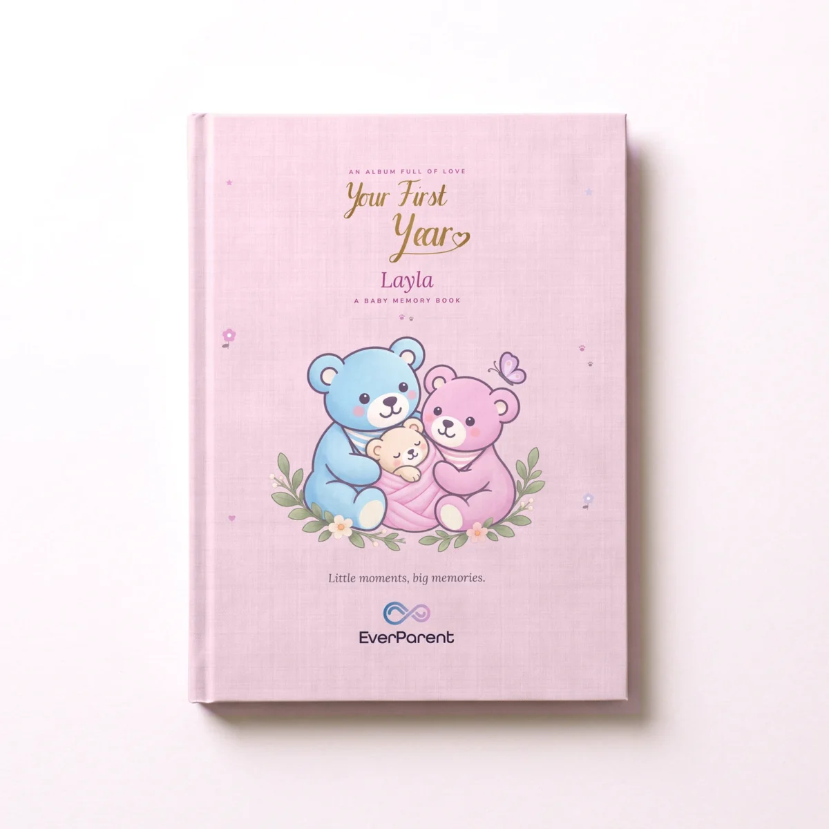 Personalized baby book “Your First Year” in pink with the name Layla on the hardcover, seen from above